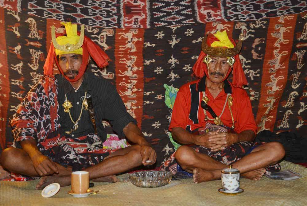 Two of the male papanggan, ritual attendants who accompany the coffin