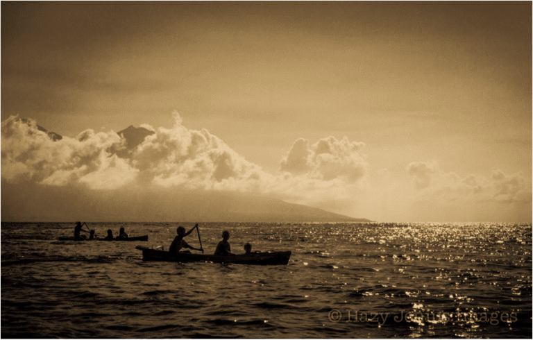 Kids in dugout canoe boat